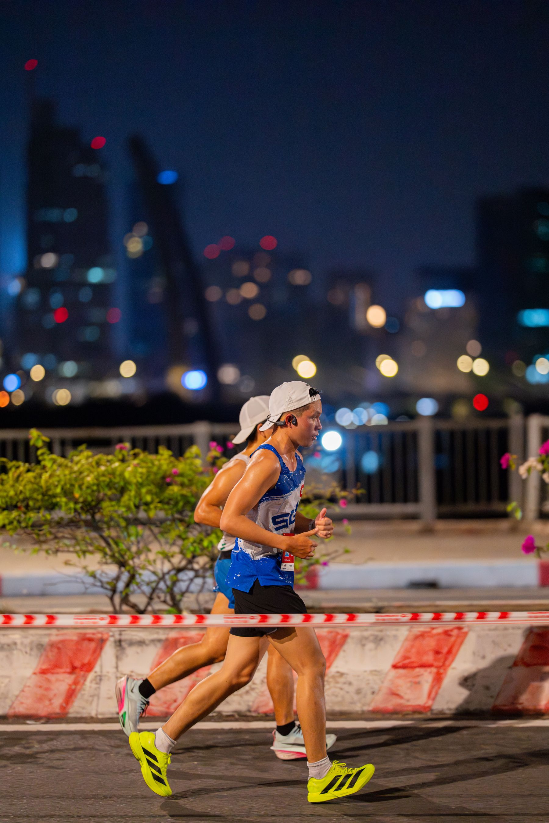 Runners taking part in a city race after dark
