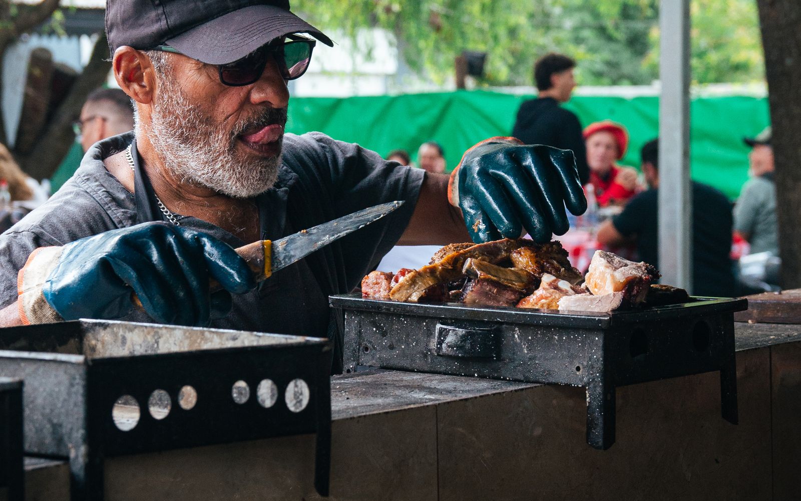 Chef grilling food at an outdoor festival