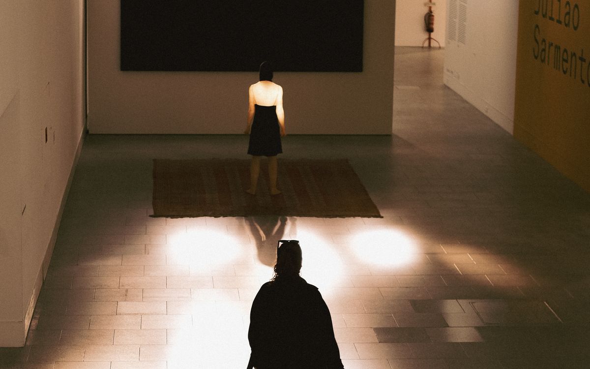 Visitors walking through a contemporary art gallery