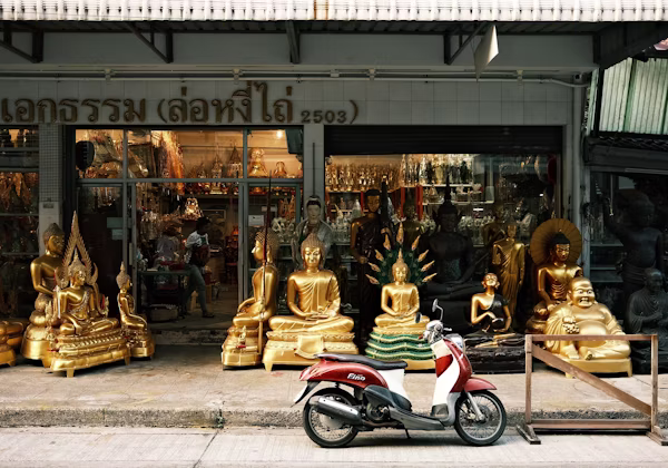 Scooter parked beside a road in Thailand
