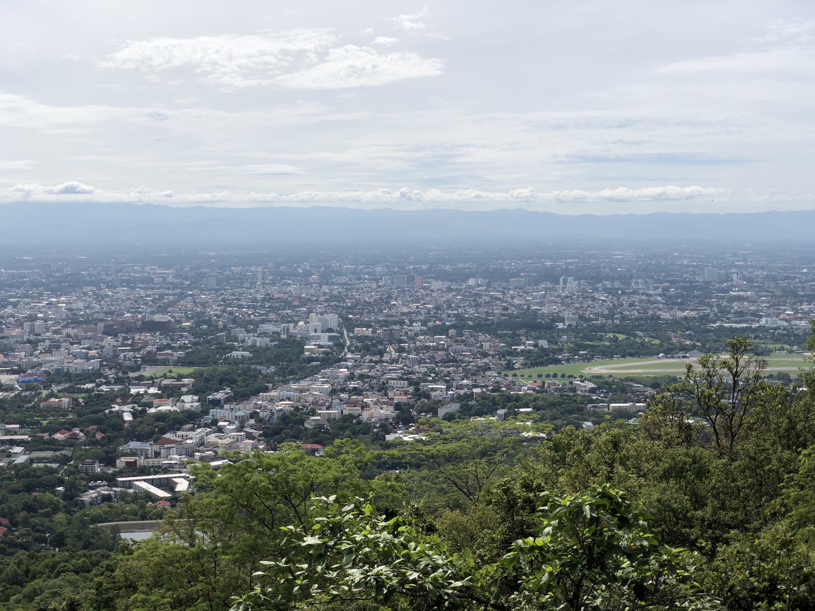 A daytime view over Chiang Mai from Doi Suthep with the city spread below