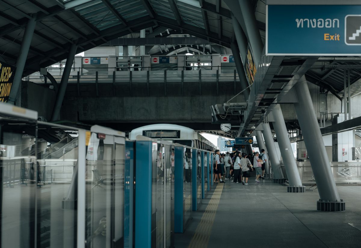 Passengers waiting at a Bangkok Skytrain station