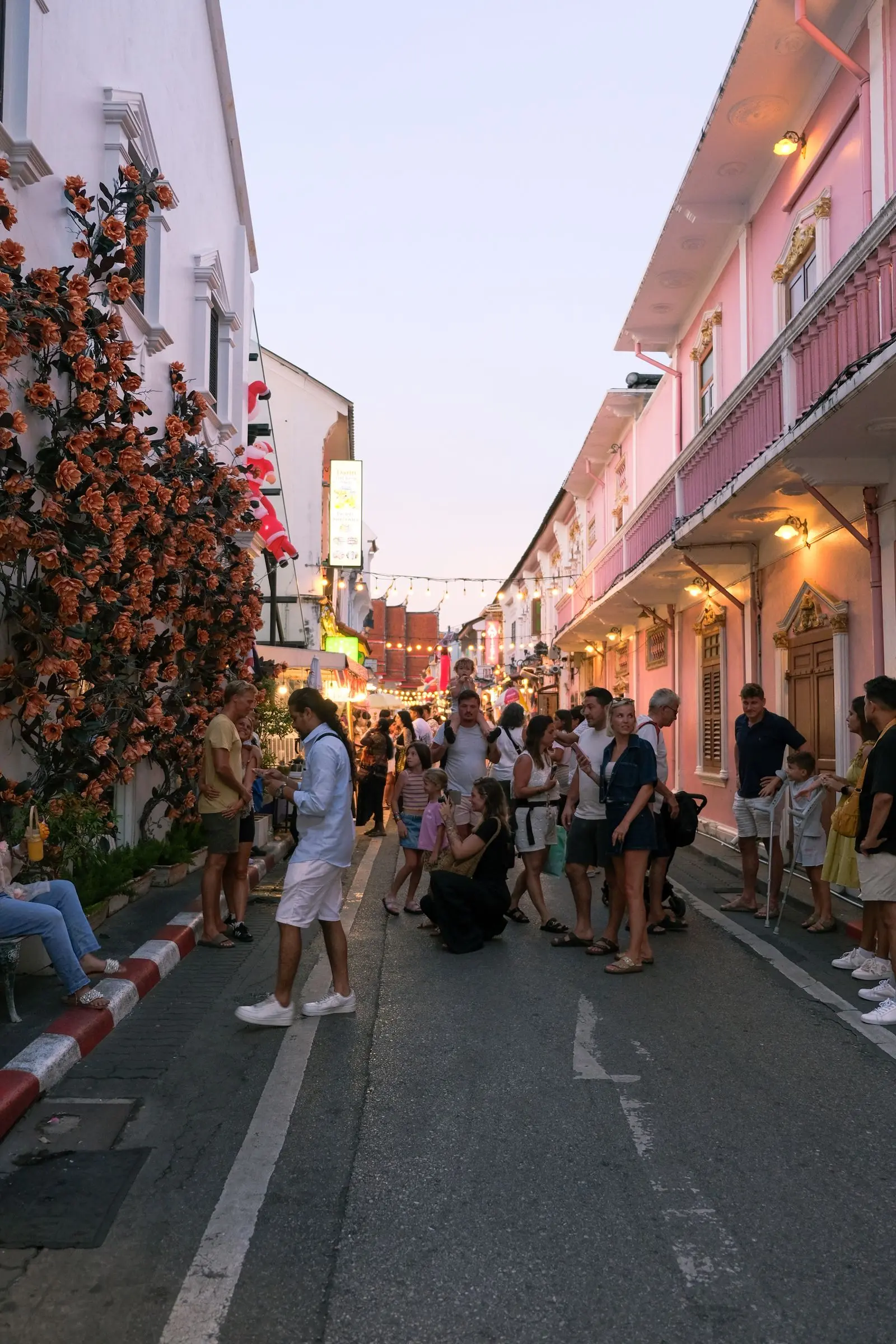 Lively evening street in a colourful Phuket neighbourhood
