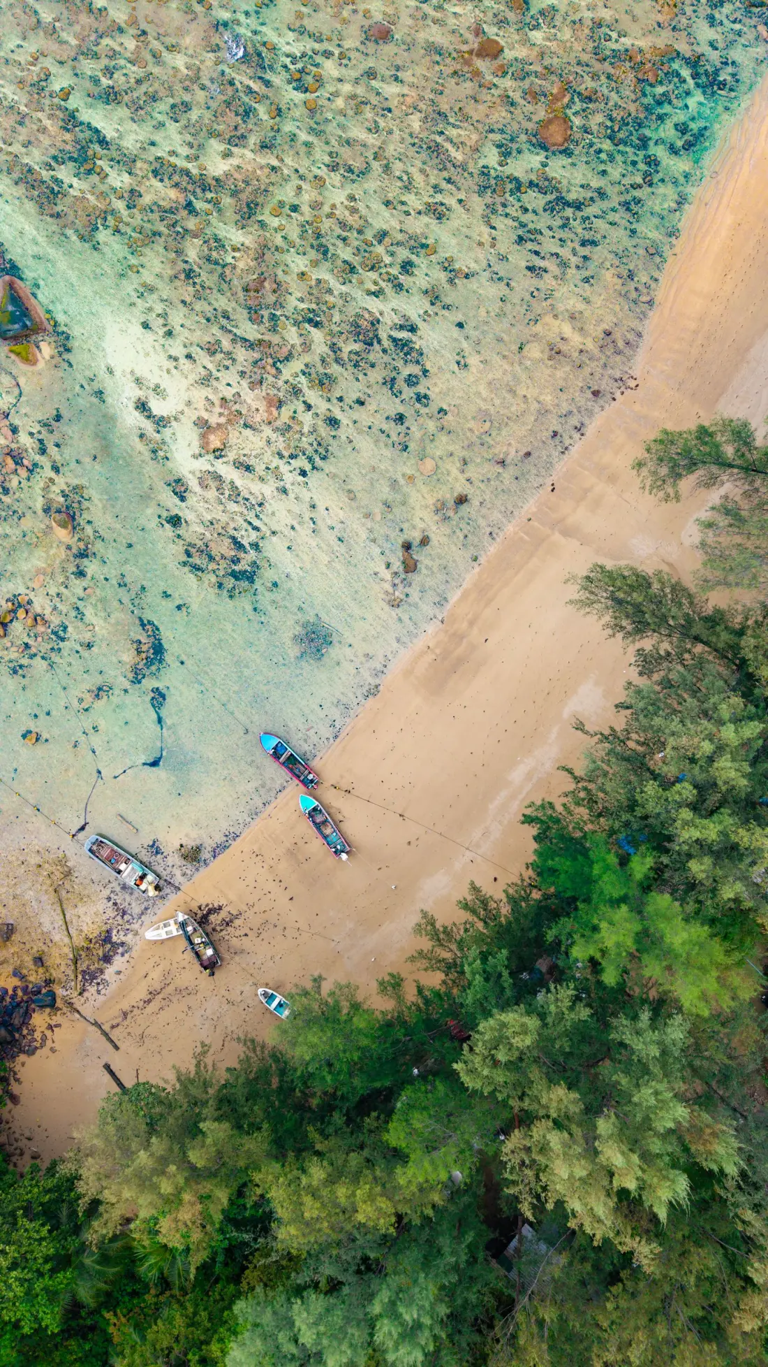Phuket coastline, forest and boats seen from above
