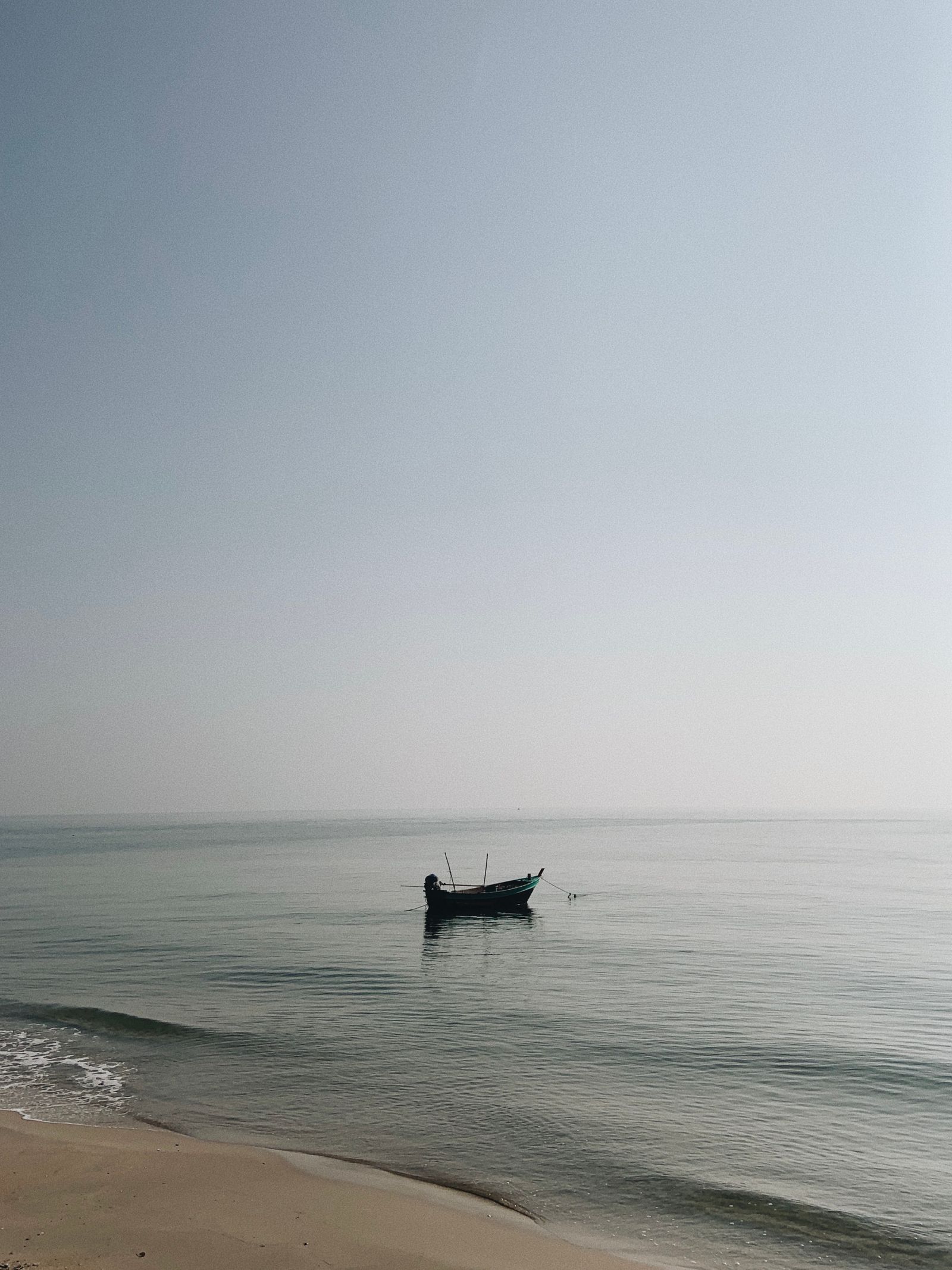 Fishing boat on the calm sea at Hua Hin